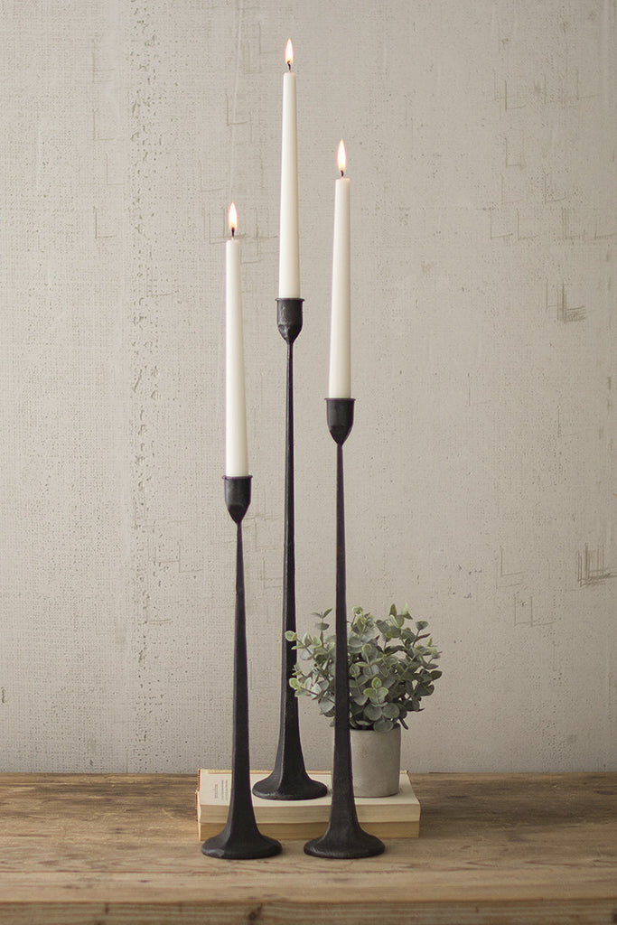 A group of 3 popular tall cast iron cone candlesticks. Candle pillar